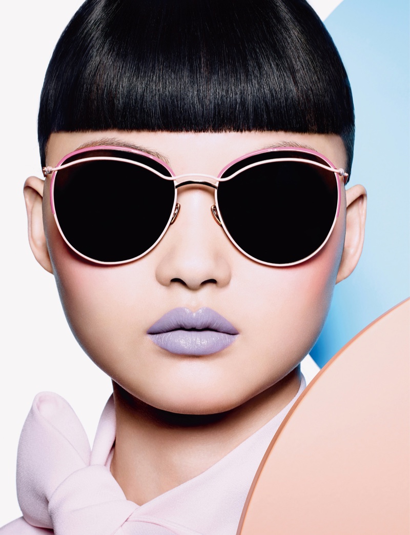 Wearing Dior sunglasses, He Cong models a purple matte lip color