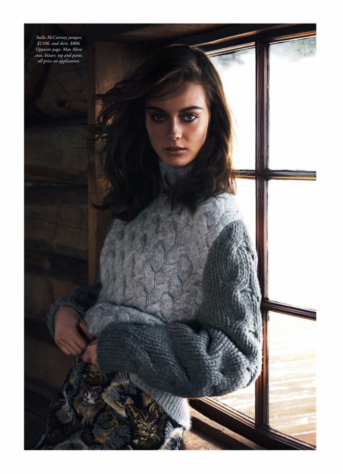 Jac Jagaciak poses in knit sweater from Stella McCartney with printed skirt