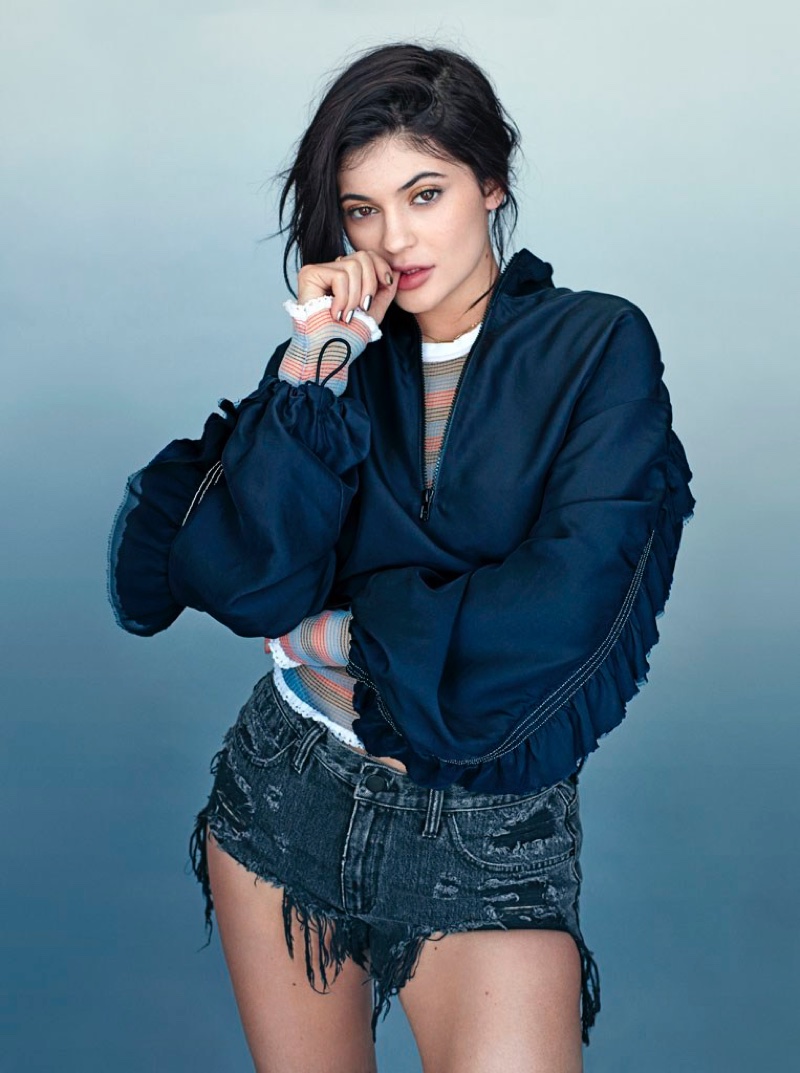 Clad in ripped denim and top from Alexander Wang, Kylie Jenner poses in 3.1 Phillip Lim jacket