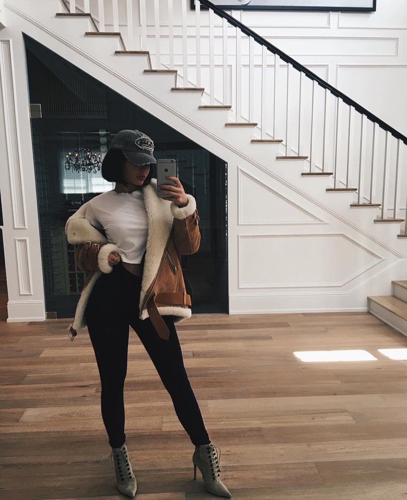 Kylie Jenner shares a stylish outfit including a shearling bomber jacket, white tee and leggings. Photo: Instagram