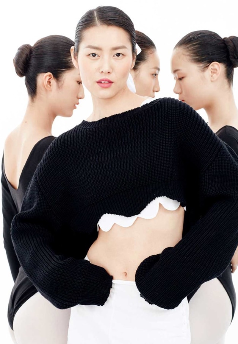 Liu Wen flaunts her midsection in a cropped Dior sweater with scalloped edges