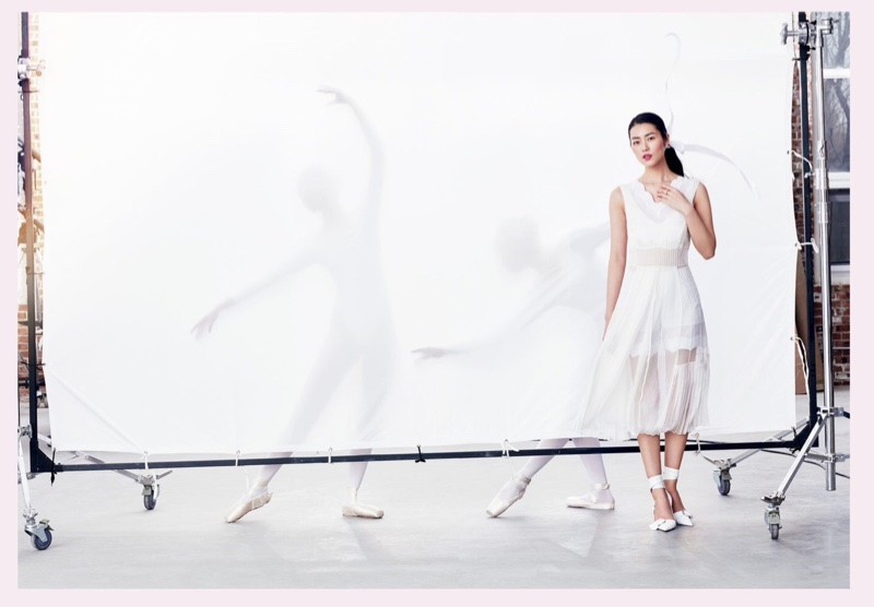 Liu Wen poses in white Dior dress with pumps, also from the brand