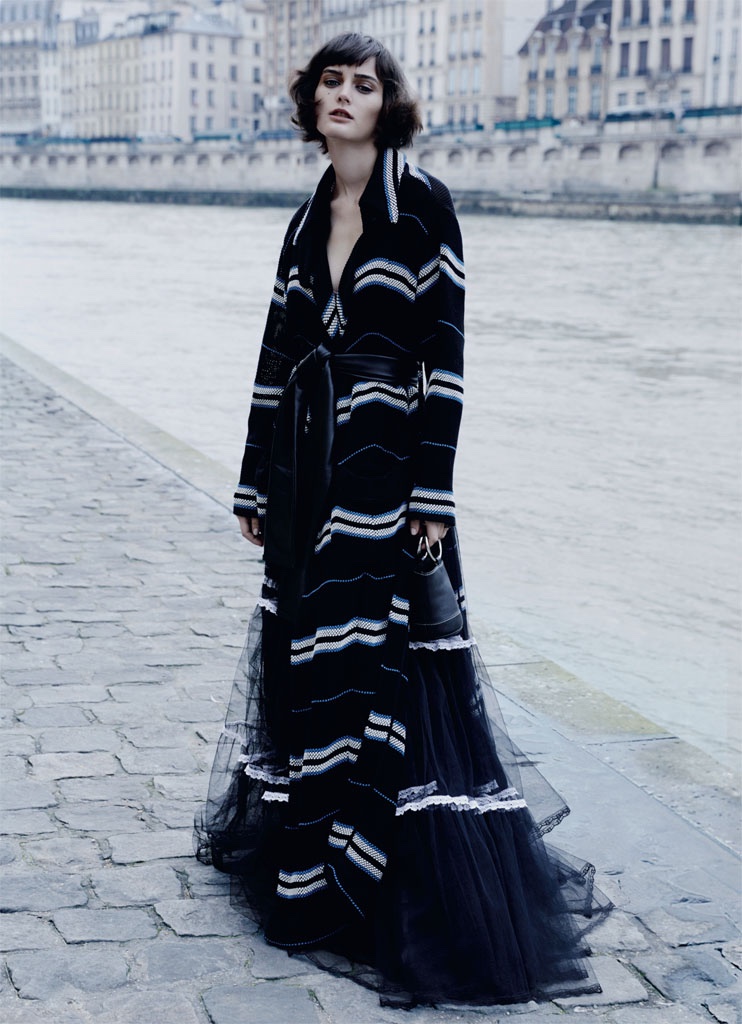 Sibui stands out in wool coat, leather belt and silk tulle skirt from Preen by Thornton Bregazzi with Simon Miller bag