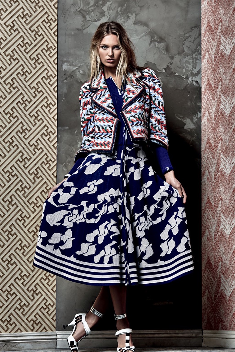 Romee Strijd poses in printed Chanel jacket and A-line skirt