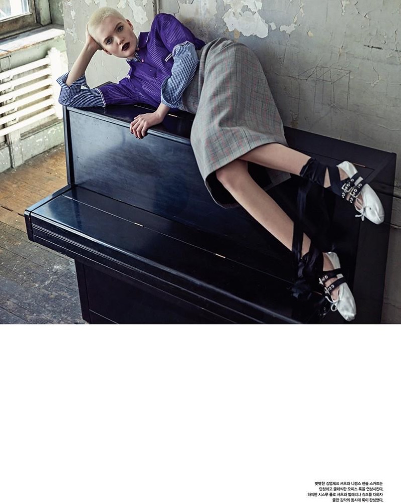 Lounging on a piano, Ruth Bell wears Miu Miu look with flats