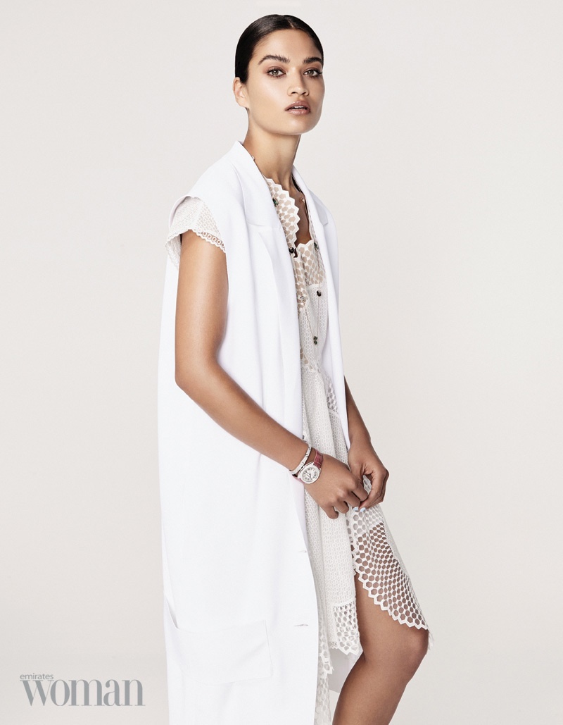 Posing in all white, Shanina Shaik wears Cartier jewelry with Stella McCartney jacket and mesh dress