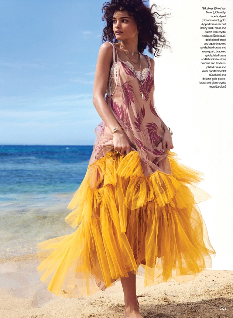 Vie poses on the sand in a Dries Van Noten silk dress with tiered ruffles 
