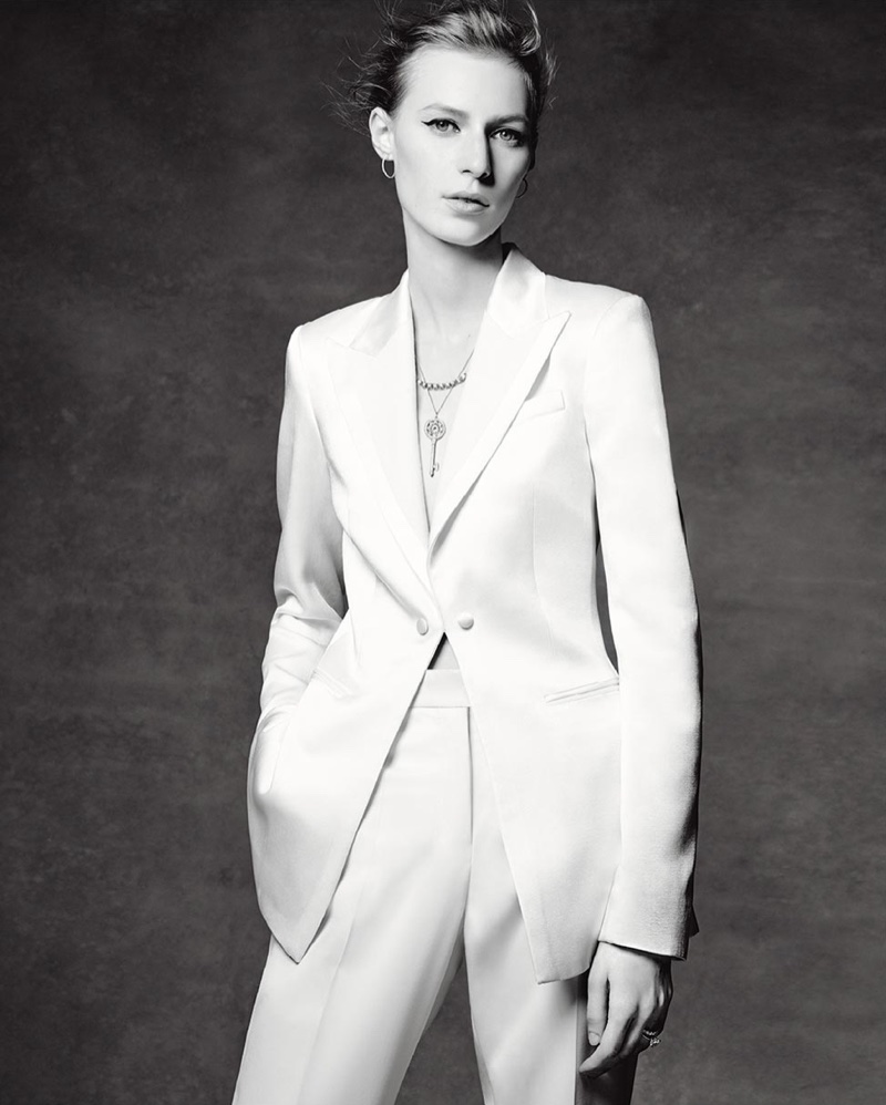 Julia Nobis suits up while wearing Tiffany & Co. necklaces, earrings and ring