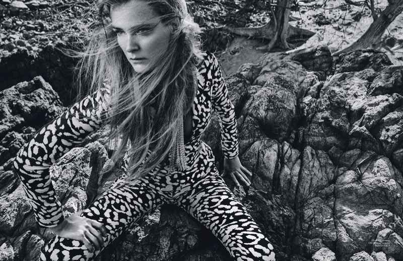 Carmen Kass models printed Dior jacket and pants