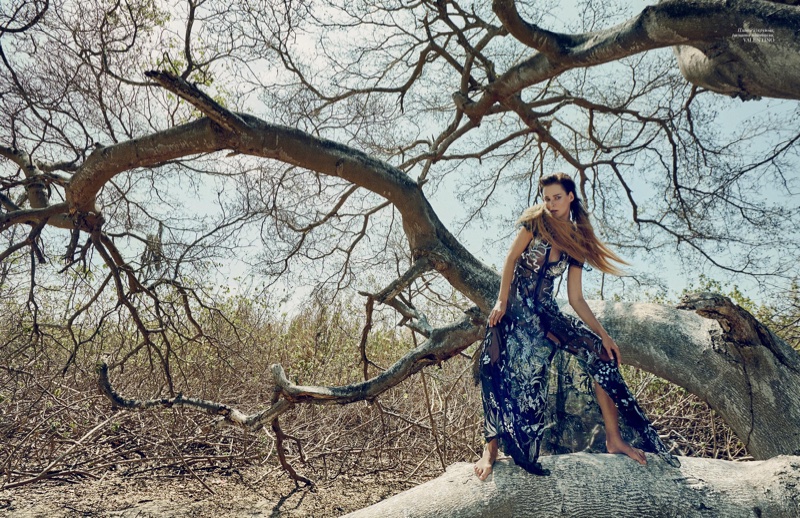 Posing outdoors, Carmen Kass models Valentino embroidered gown