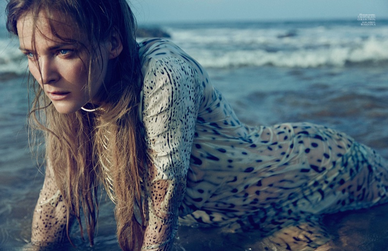 On the shore, Carmen Kass wears Calvin Klein Collection dress with Rosantica jewelry