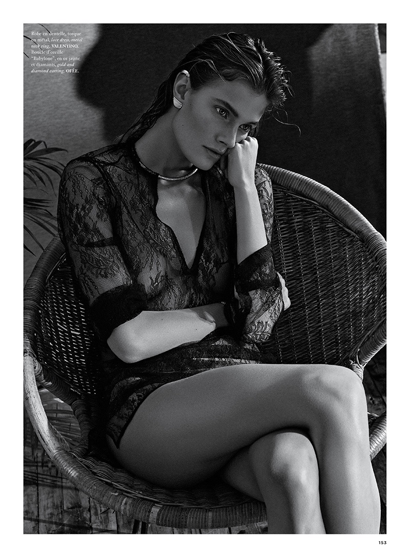 The blonde model poses in Valentino lace mini dress with Ofée jewelry
