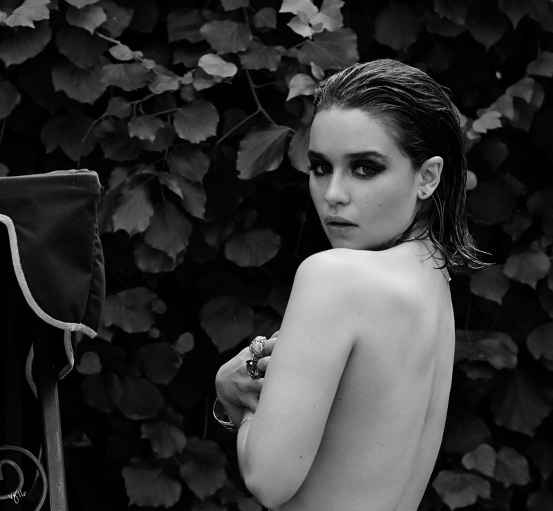 Emilia Clarke does a seductive pose while topless