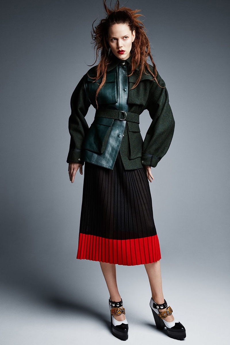 The brunette model wears Celine wool and leather jacket with pleated Salvatore Ferragamo skirt and Mulberry heels