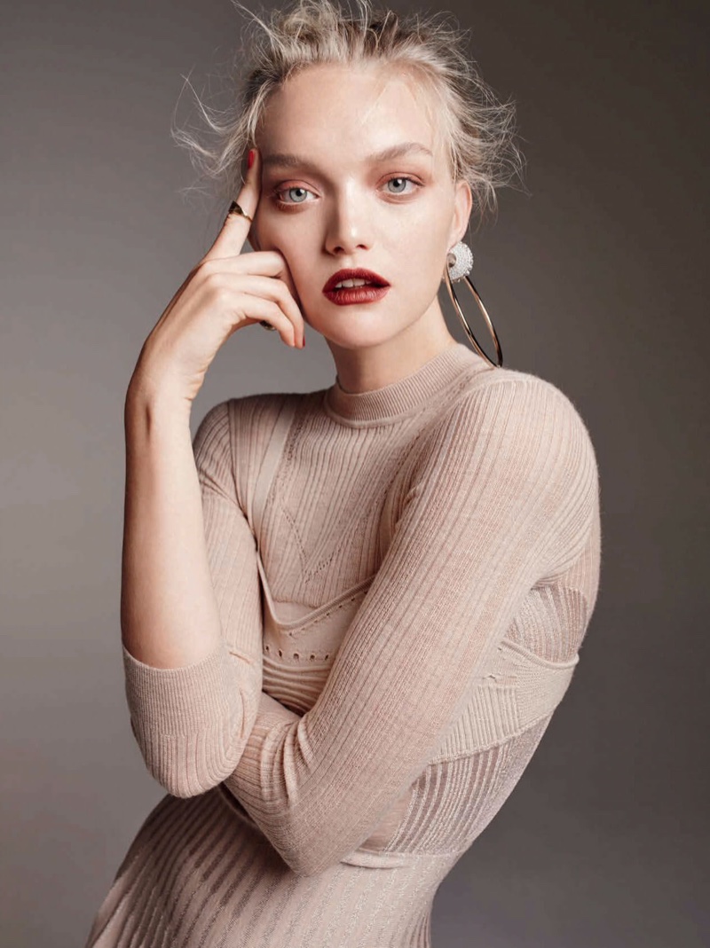 Gemma Ward poses with mussed hairstyle and knit dress