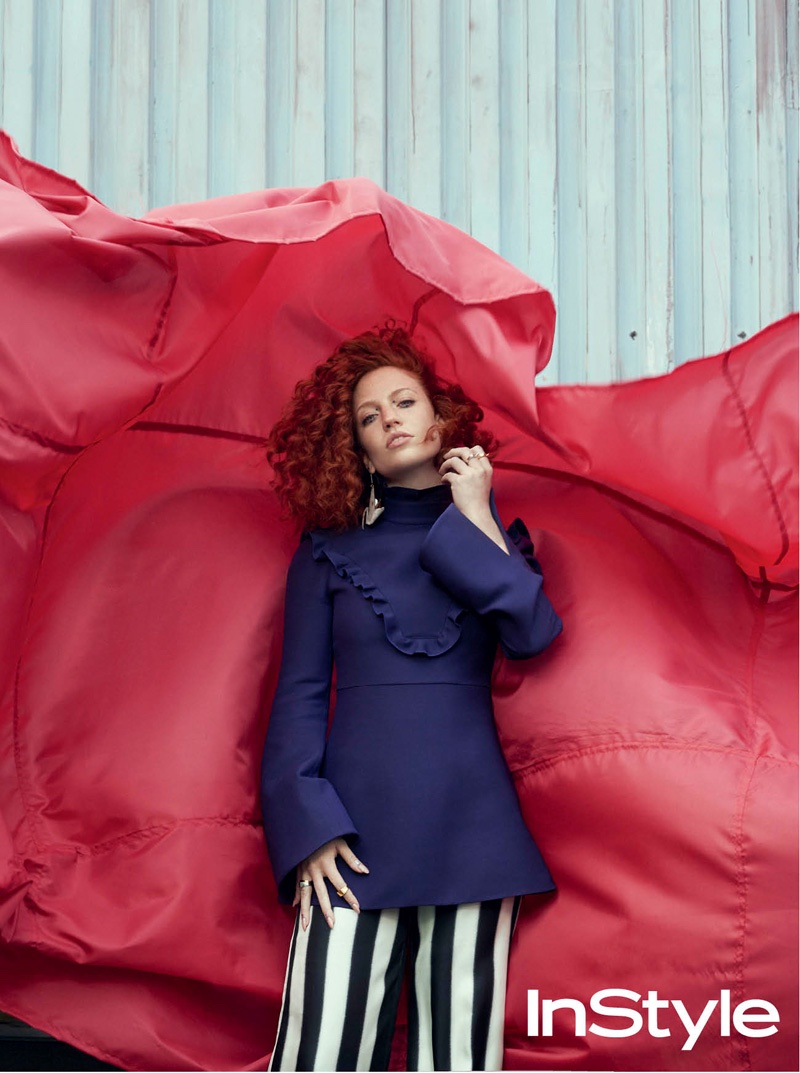 Singer Jess Glynne wears ruffle embellished top and striped pants