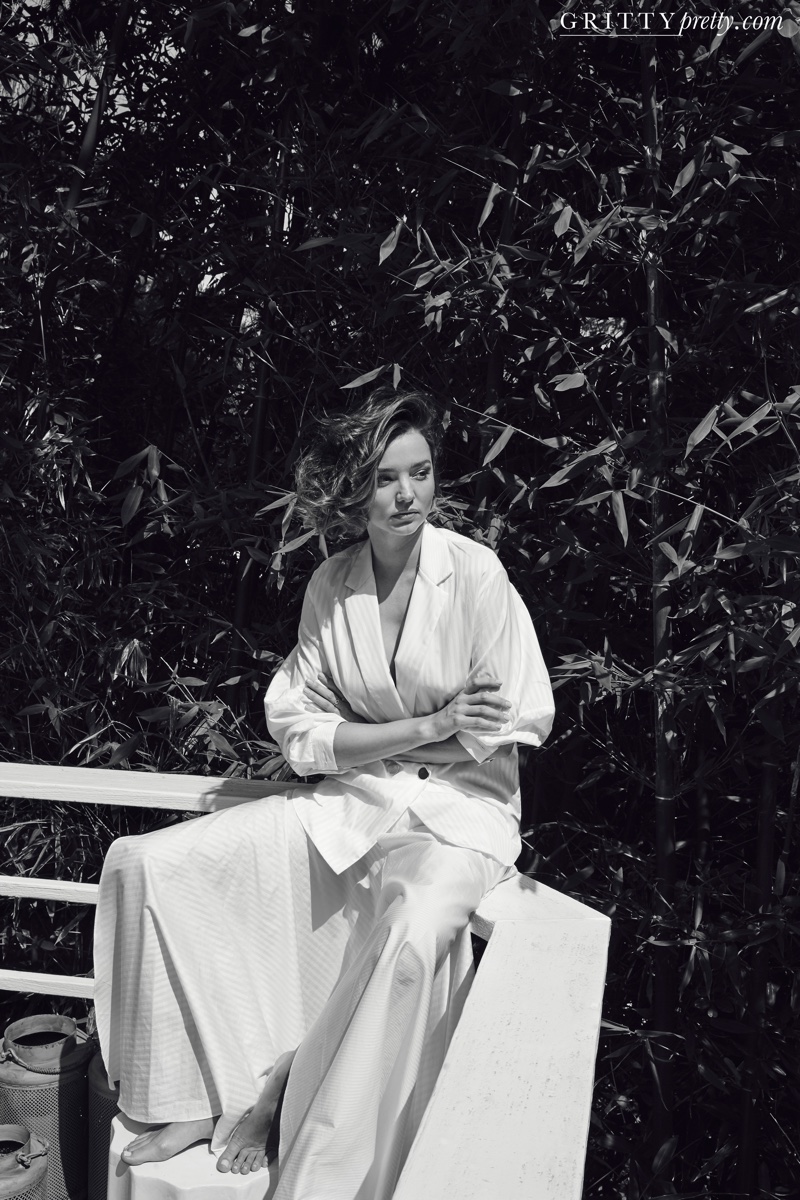 Photographed in black and white, Miranda Kerr models Michael Lo Sordo jacket and skirt