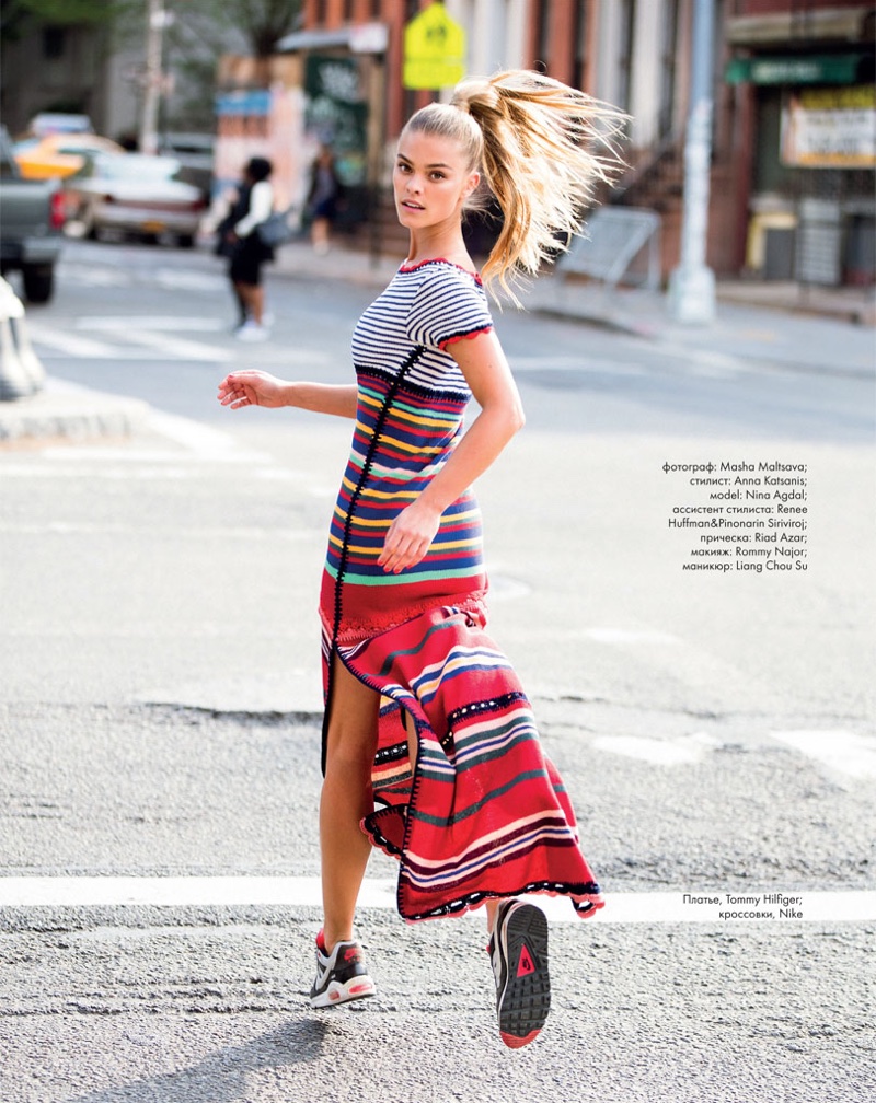 Photographed mid-run, Nina Agdal wears Tommy Hilfiger striped dress with Nike sneakers