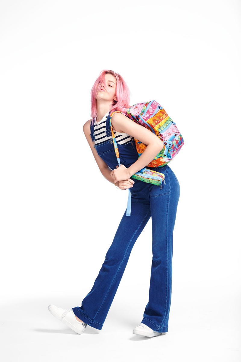 Pyper America Smith rocks overalls with a colorful backpack