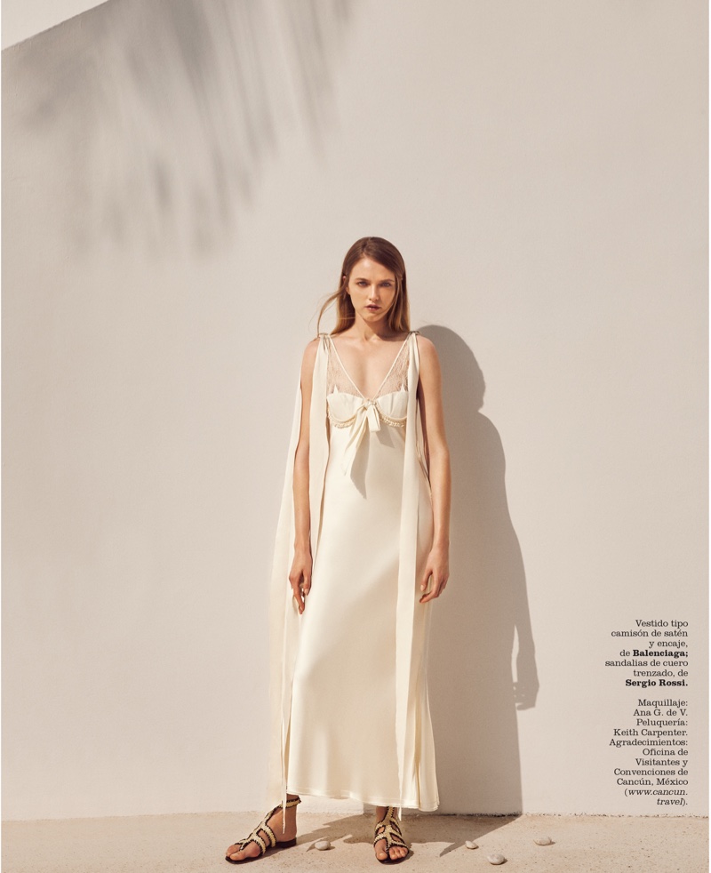 Vlada Roslyakkova wears Balenciaga satin slip dress with Sergio Rossi sandals