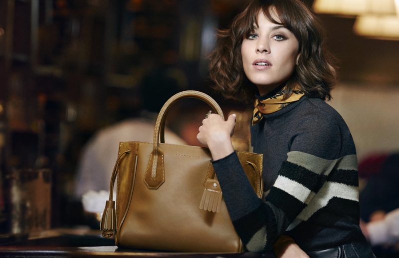 Alexa Chung poses with Longchamp's Pénélope Fantaisie bag for the label's fall-winter 2016 campaign.