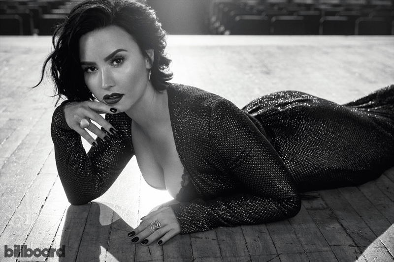 Demi Lovato flaunts her curves in a form-fitting sequin dress