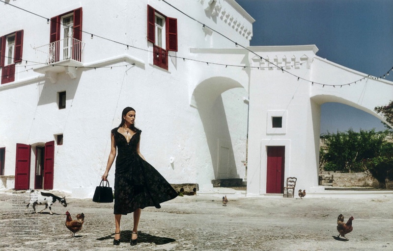 Irina Shayk models fit and flare dress from Miu Miu