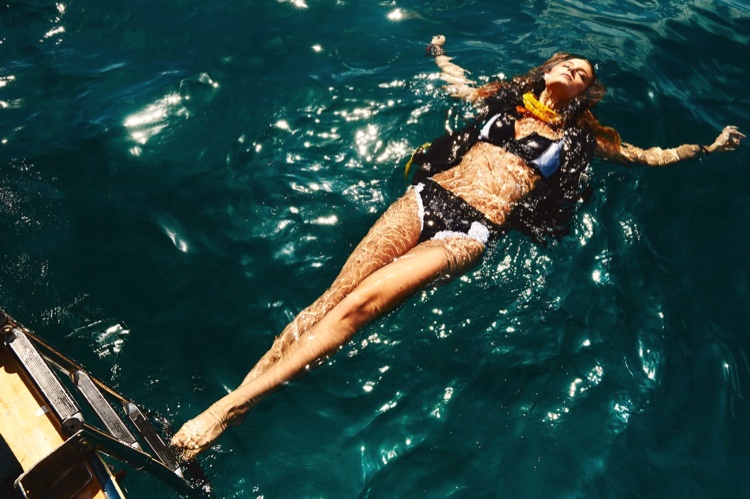 Kate Bock dives into the ocean wearing a Baku bikini