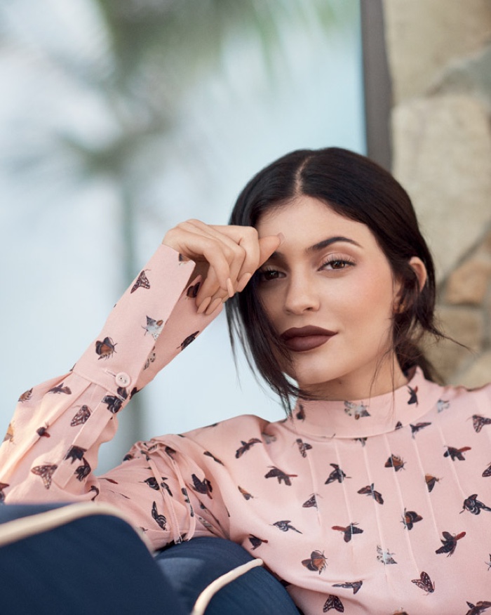 Kylie Jenner wears a dark red lipstick shade in the feature