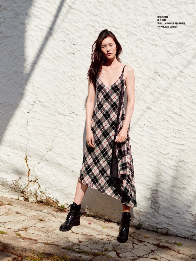 Liu Wen has a grunge moment in plaid dress and boots from Louis Vuitton