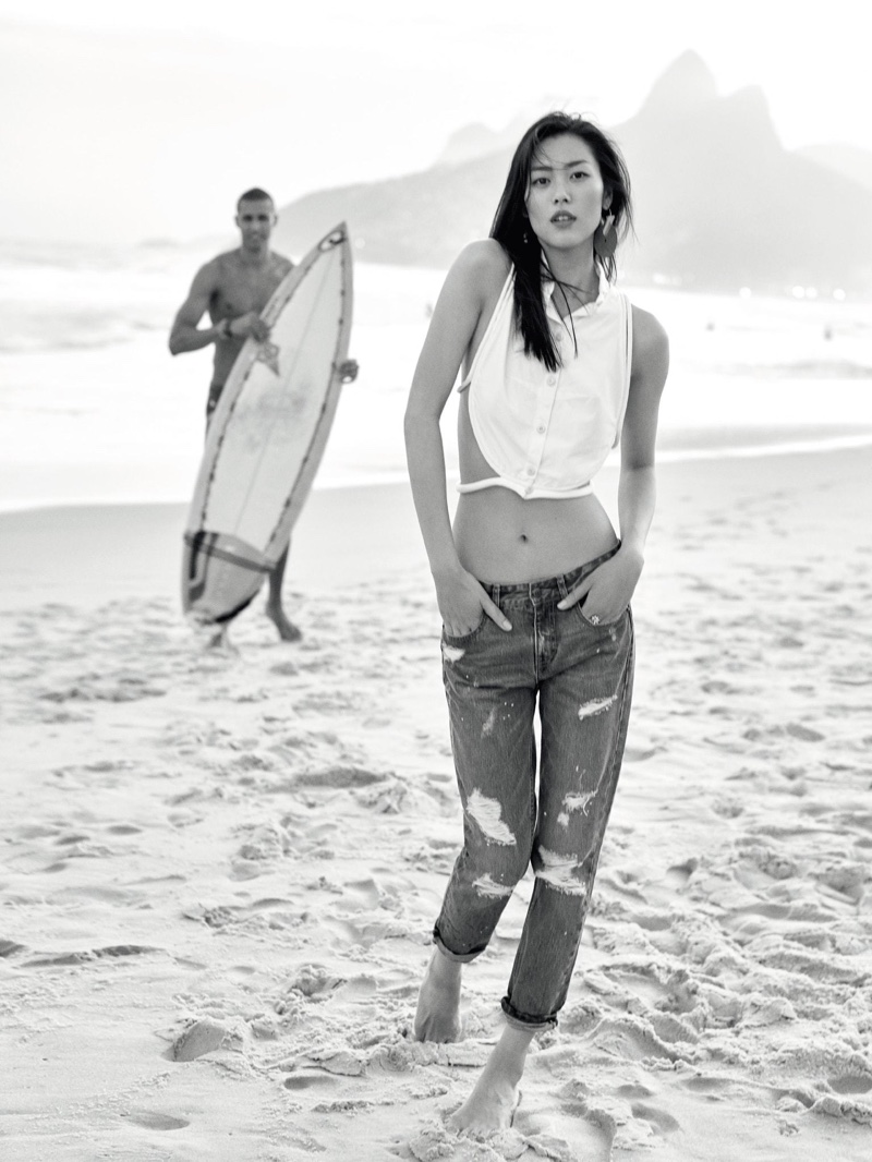 Liu Wen hits the beach in cropped shirt and distressed denim