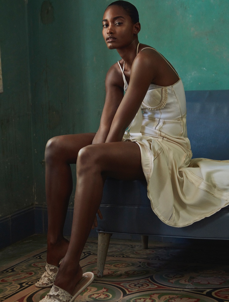 Melodie Monrose poses in Balenciaga slip dress with lace slippers