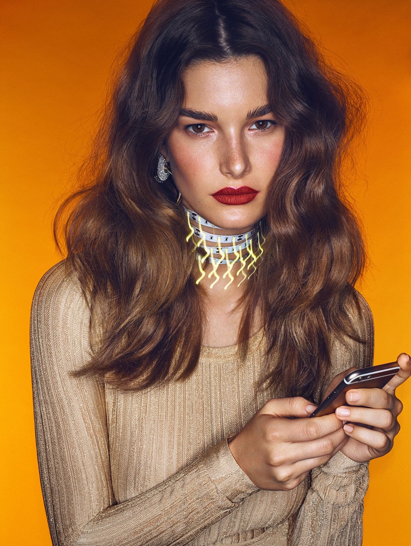 The brunette model serves major beauty inspiration with pumped up waves and red lipstick