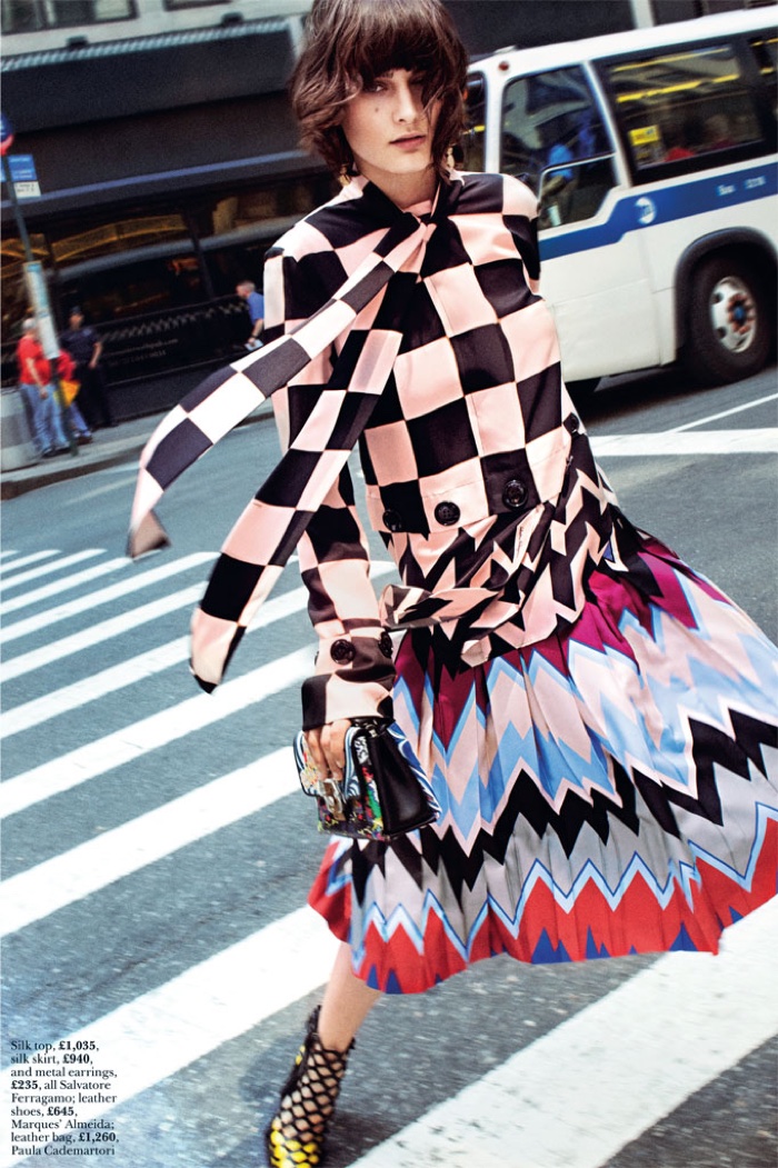 The model hits the streets in Salvatore Ferragamo silk top and skirt 