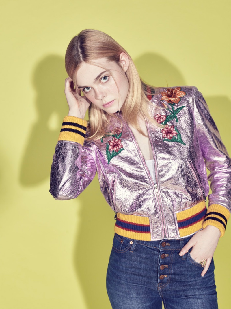 Elle Fanning poses in embroidered bomber jacket from Gucci