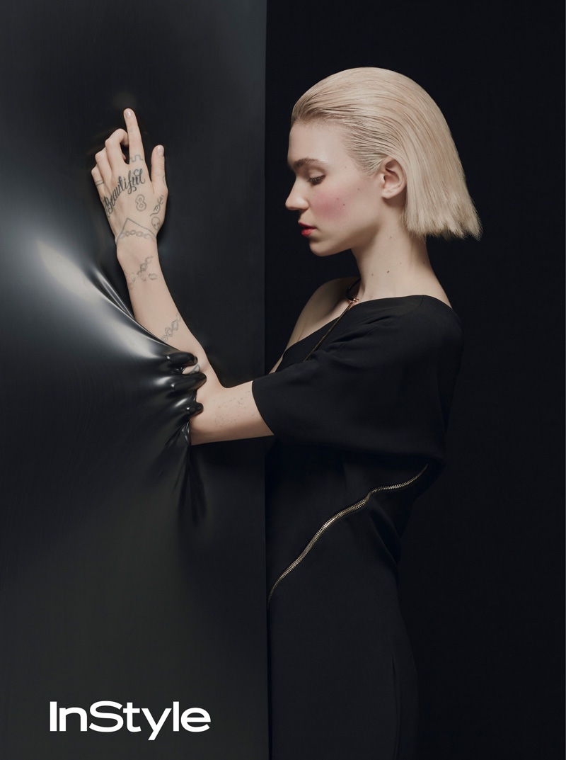 Grimes poses in black dress for the photoshoot