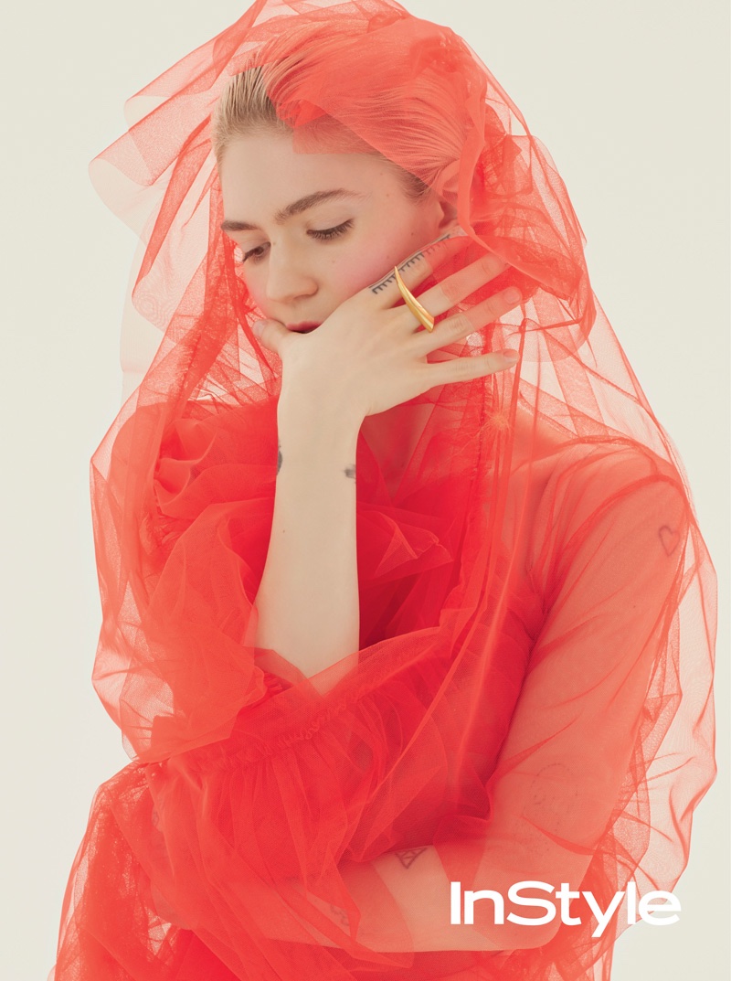 Singer Grimes poses in sheer fabric