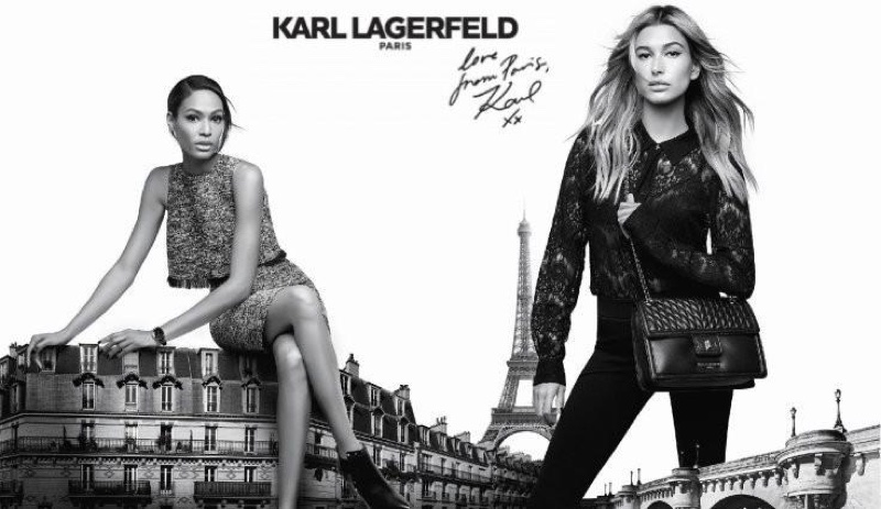Joan Smalls and Hailey Baldwin pose next to the Eiffel Tower for Karl Lagerfeld Paris campaign