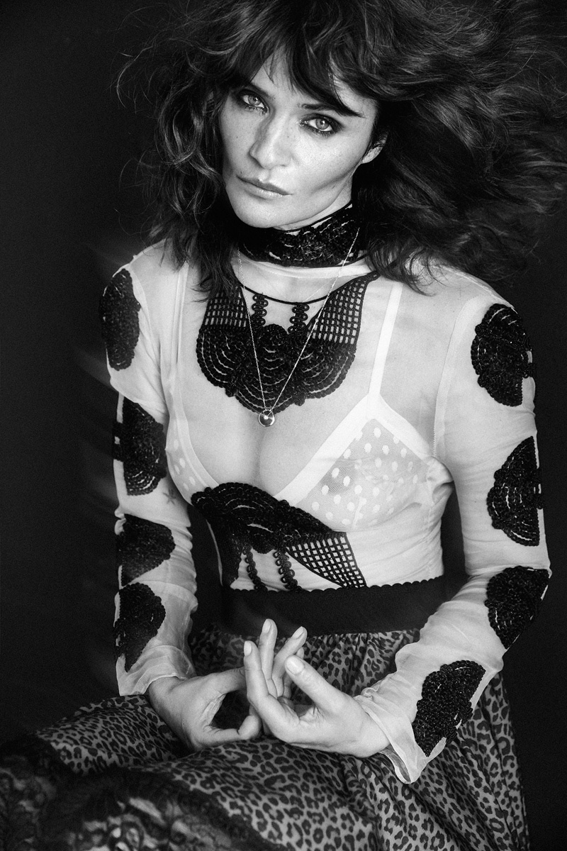 Helena Christensen models embroidered top and leopard print skirt