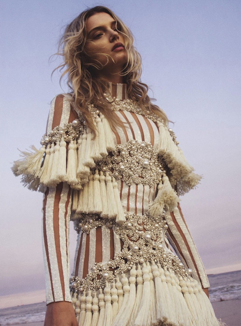 The model wears shimmering fringe dress from Balmain