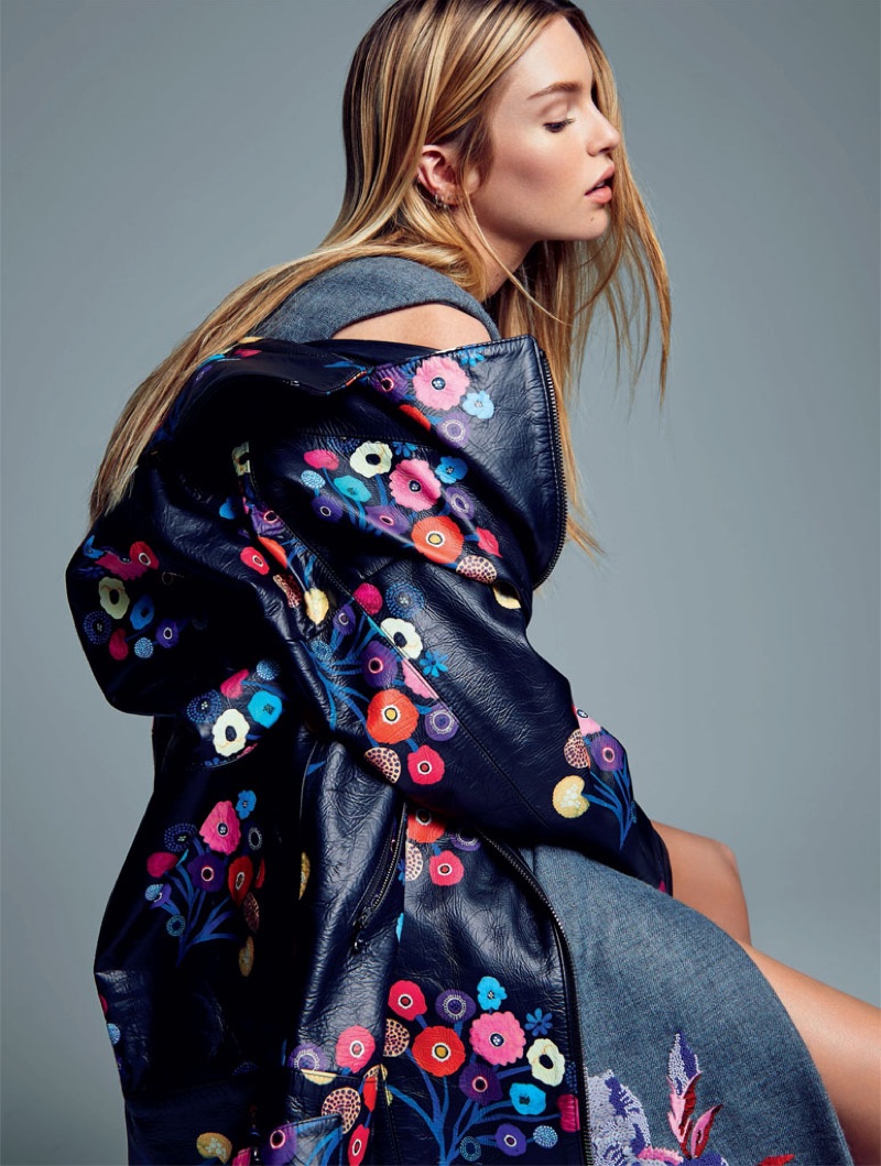 Stella Maxwell wears embroidered coat Stella Maxwell models Tanya Taylor jacket and Kenzo dress