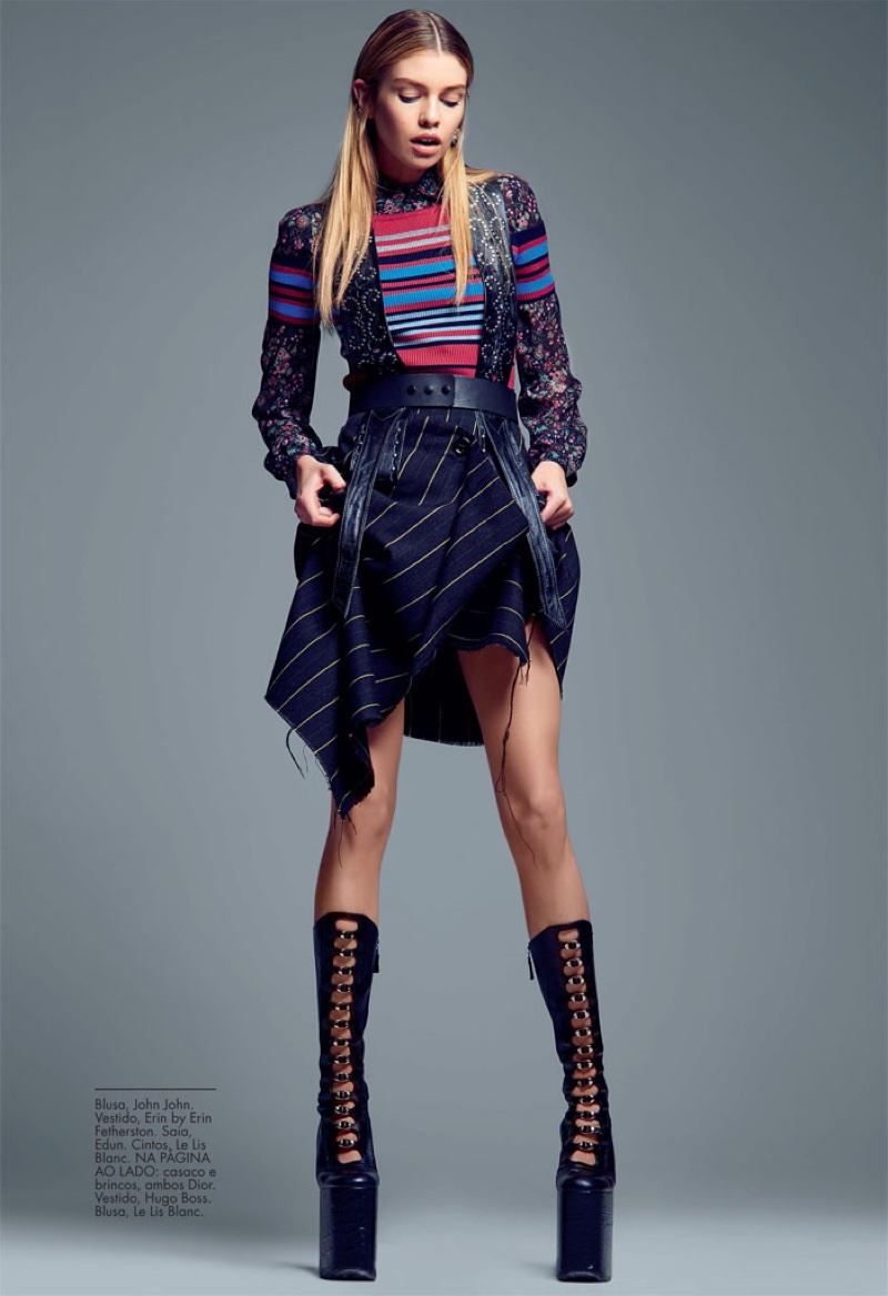 Stella Maxwell wears John John blouse and Erin by Erin Fetherston dress with boots from Edun