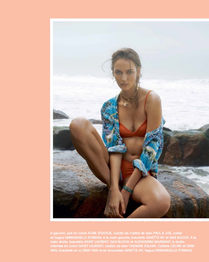The brunette poses on the beach wearing Acne Studios sweater with Paul & Joe bikini