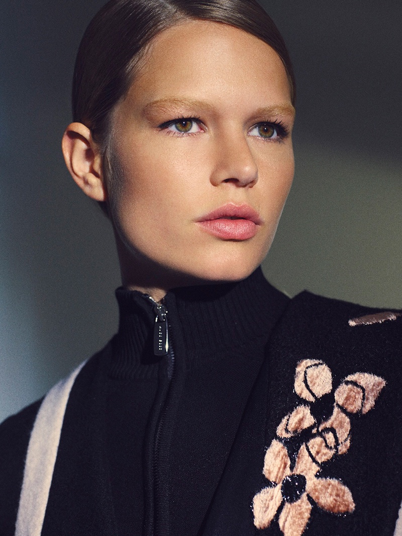 Model Anna Ewers wears BOSS top and coat