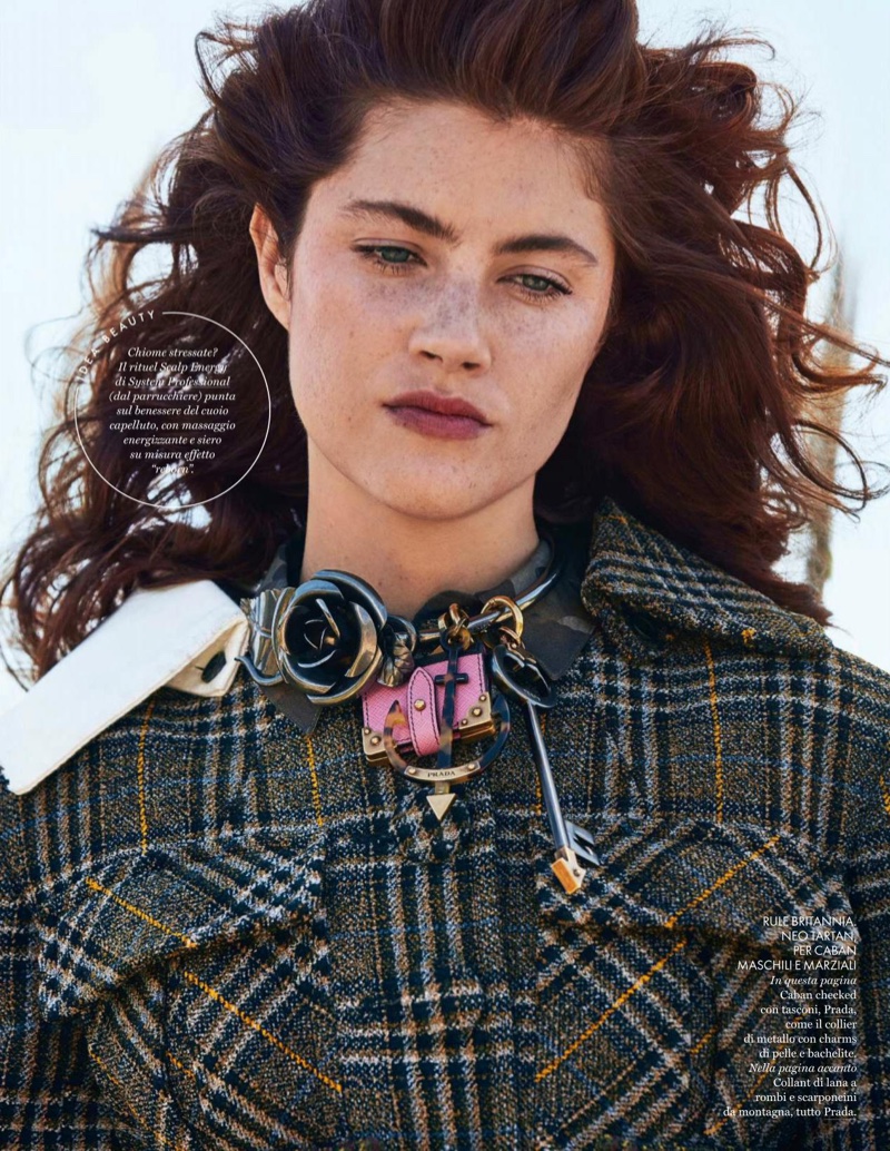 Model Anna Speckhart wears plaid Prada coat and accessories
