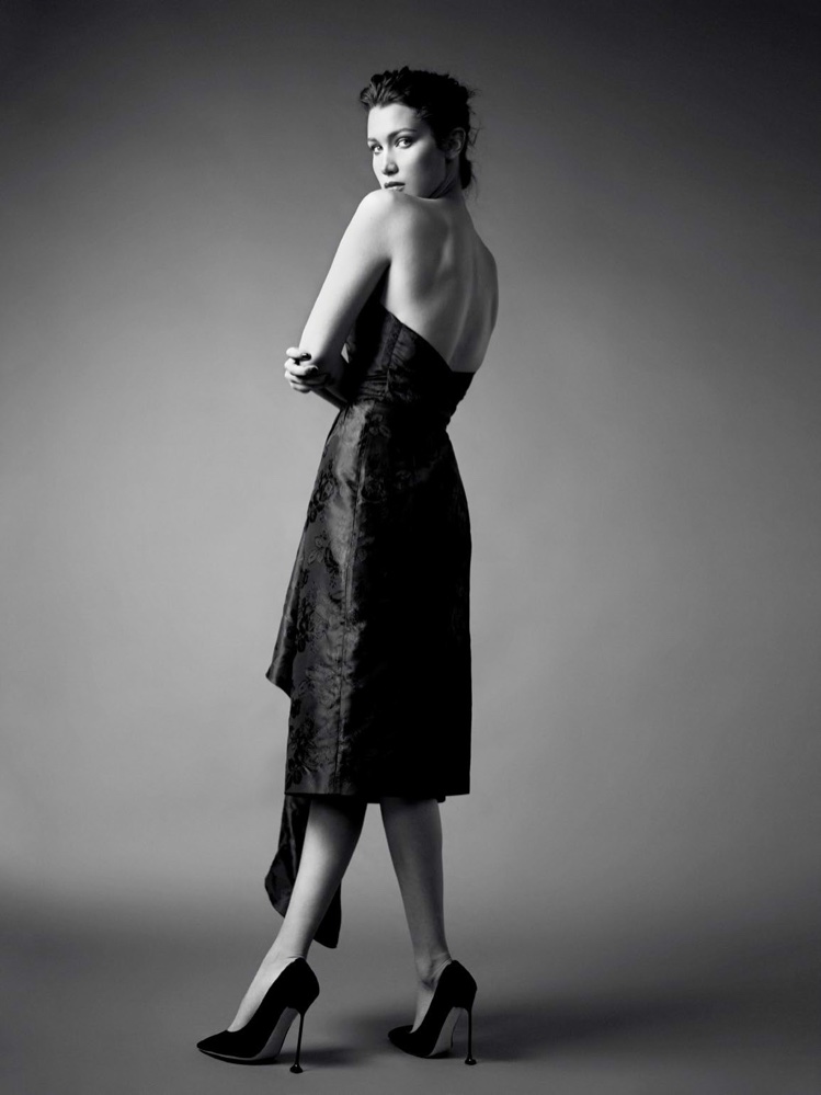 Photographed in black and white, Bella Hadid poses in strapless dress from Miu Miu