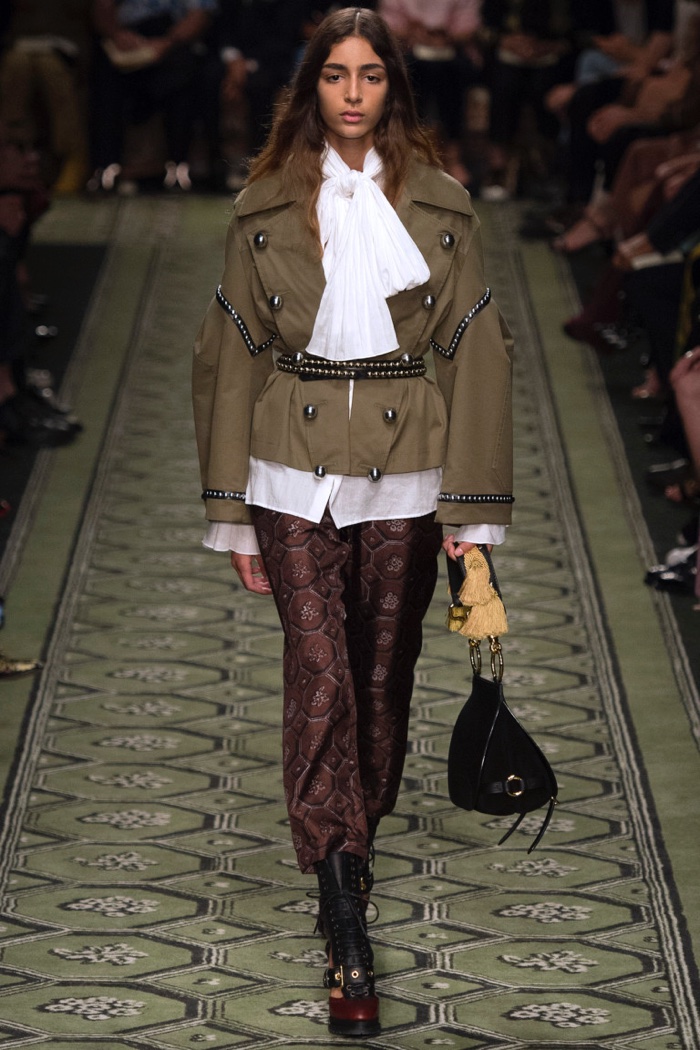 Burberry Fall 2016: Model walks the runway in military embellished jacket, cotton voile shirt with neck tie detailing and wallpaper print trousers