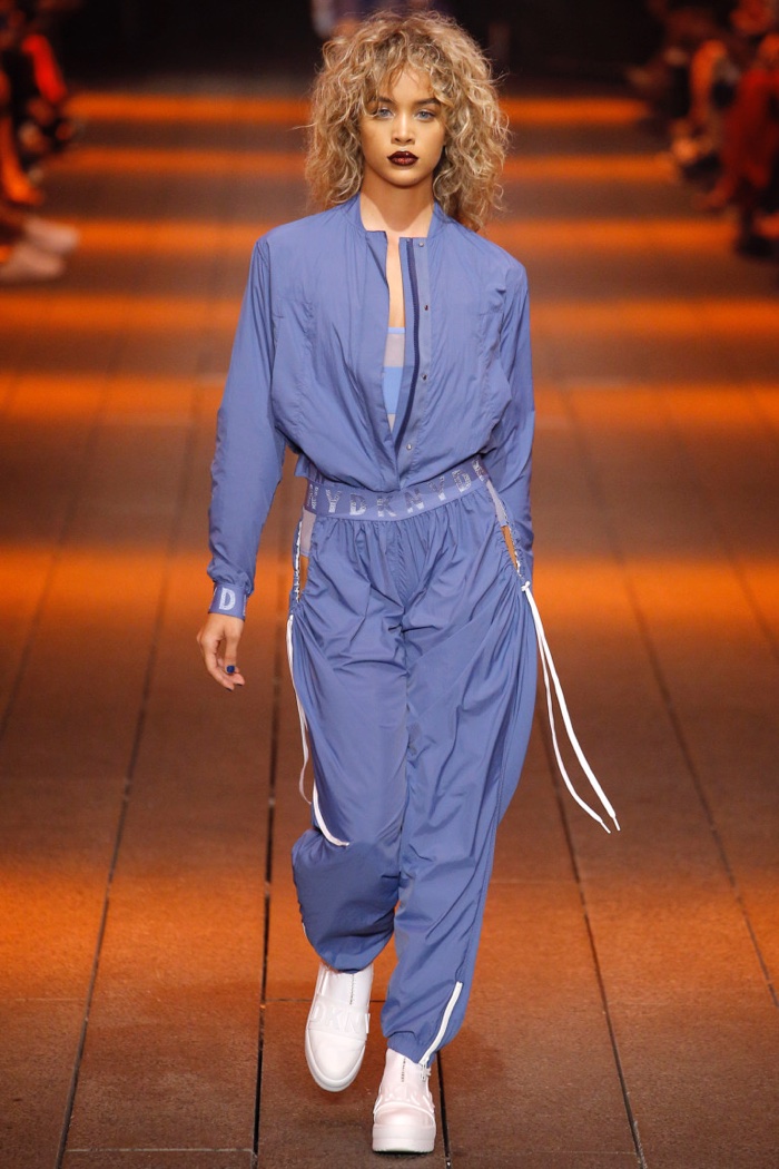 DKNY Spring 2017: Jasmine Sanders walks the runway in cadet blue floaty nylon logo bomber jacket, floaty nylon logo pant and mesh litewear logo bodysuit