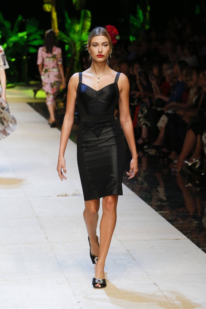 Dolce & Gabbana Spring 2017: Hailey Baldwin walks the runway in black dress with form-fitting silhouette