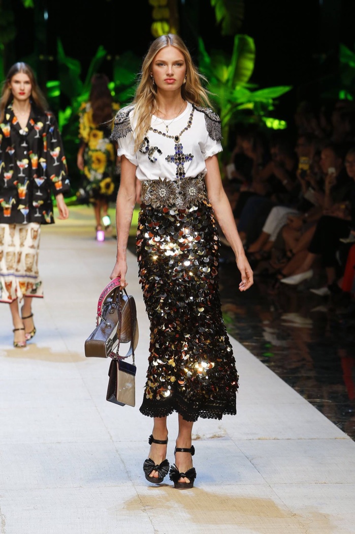 Dolce & Gabbana Spring 2017: Romee Strijd walks the runway in white t-shirt with jewelry, gold belt and paillette embellished skirt